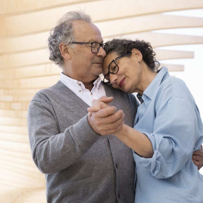 medium-shot-senior-people-dancing-outside